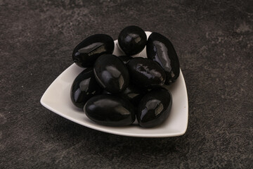 Pickled black olives in the bowl