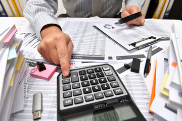 business concept - businessman working with reports in office, table and workspace close view,...
