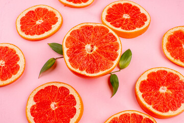 front view tasty grapefruits sliced juicy fruits lined on pink background healthy life juice fresh color diet