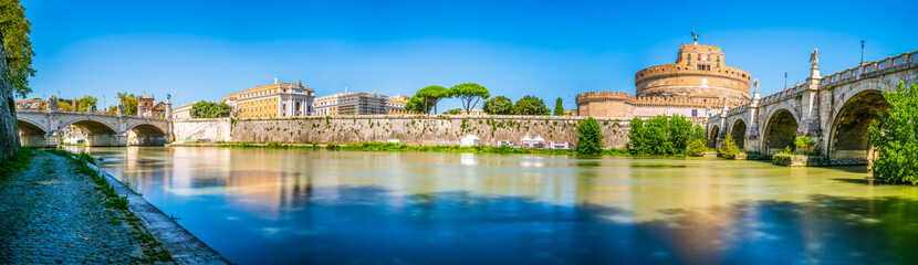 River Tiber panorama with Saint Angelo castle and old bridge at sunny day in Rome, Italy