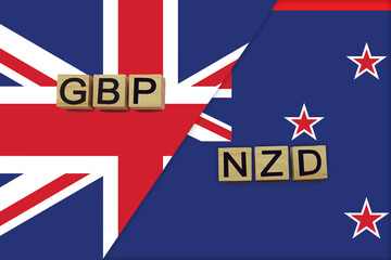 Fototapeta na wymiar United Kingdom and New Zealand currencies codes on national flags background