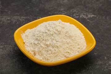 Wheat flour heap in the bowl
