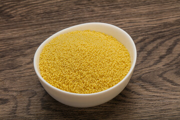 Raw cous cous heap in the bowl