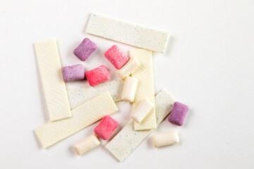 Different chewing gums on the white background