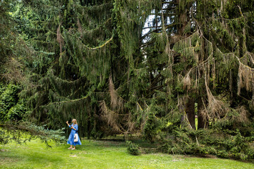 Business woman is enjoying calm moment in a forrest, keeping her stress levels down