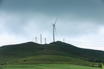 Wind turbines under blue skies