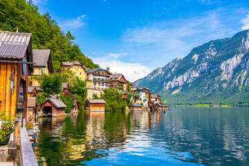 Scenic view of famous Hallstatt mountain village in the Austrian Alps at beautiful light in summer,...