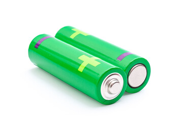 Colorful electricity storage, lithium battery and renewable energy concept with with two green AA batteries isolated on white background with clipping path cutout