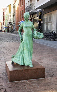 Statue of woman baker on Garbary street in Torun.  Poland