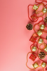 Christmas or new Year pink background with red and gold decorations for Christmas tree with free space.
