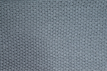 Full frame shot of knitted cloth. Gray textured background, trendy color 2021