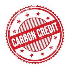 CARBON CREDIT text written on red grungy round stamp.