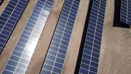 solar power panels in the desert. aerial top above view of photovoltaic PV modules in a Solar energy plant farm background - 399741330