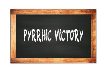 PYRRHIC  VICTORY text written on wooden frame school blackboard.