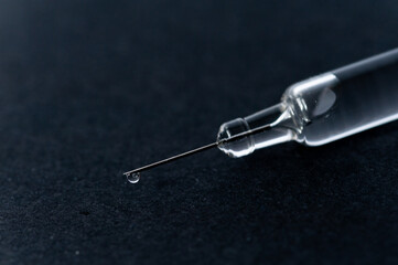 syringe isolated on black background
