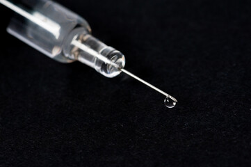syringe isolated on black background