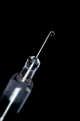 syringe isolated on black background