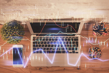 Multi exposure of financial chart drawing over table background with computer. Concept of research. Top view.