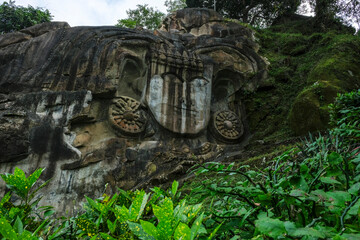 Sculptures carved into the rock at the archaeological site of Unakoti in the state of Tripura. India. - 399745533