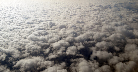 Aerial view of clouds and sky. Bird eye view from airplane window. Clouds panorama from airplane. Flight from Kiev to Sharm El Sheikh, Egypt.