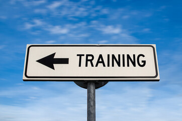 Training road sign, arrow on blue sky background. One way blank road sign with copy space. Arrow on...