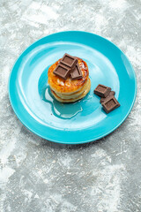 front view delicious muffins with honey and chocolate on light background drink photo color ceremony breakfast tea