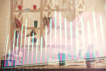 Double exposure of stock market graph drawing and office interior background. Concept of financial analysis.