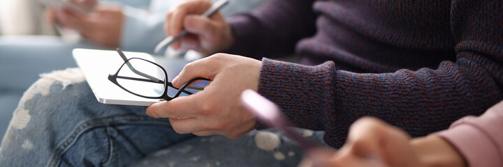 Man holding tablet and stylus in line closeup. Using gadgets concept