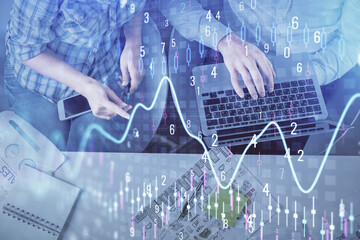 Multi exposure of man and woman working together and forex graph hologram drawing. Financial...
