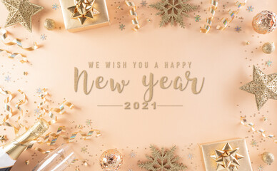 Fototapeta na wymiar Happy New year celebration background concept. Golden gift box, stars, christmas ball and champagne on pastel background.