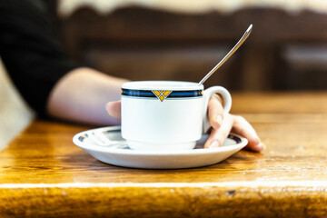girl in a coffee shop smiling