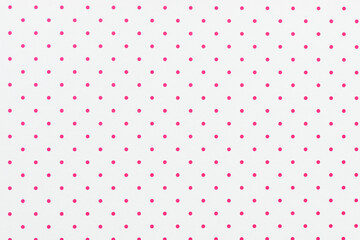 White sheet of paper with pink polka dots. For use as a background or texture. - obrazy, fototapety, plakaty