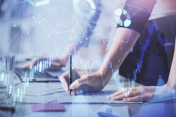 Multi exposure of woman hands typing on computer and financial chart hologram drawing. Stock market analysis concept.