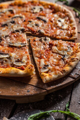 Italian pizza on wooden board