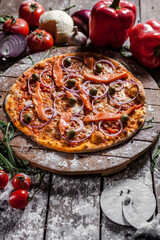 Italian pizza on wooden board