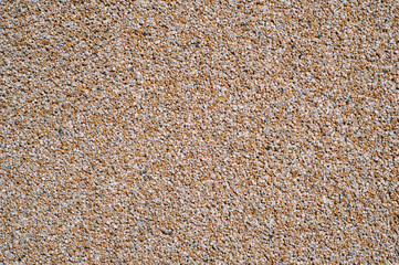 Sea small browm pebbles pattern. Natural gravel background. Abstract texture wallpaper composition.