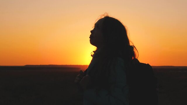happy girl teen child closed her eyes dream. teenage kid wants a dream come true portrait at sunset. woman daughter silhouette dream of a happy childhood. free face sister closed eyes