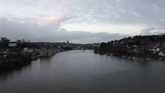 fly up the Truro river towards the cathedral at dusk cornwall England uk aerial drone 