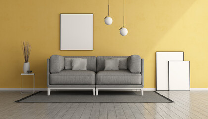 Yellow living room with gray sofa
