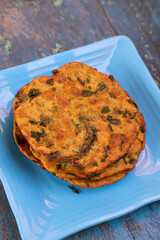 Delicious Indian Masala Puri or Methi Puri. Indian Bread Made of fenugreek leaves.