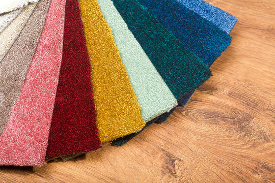 Types and samples of carpets in different colors. Carpets for rooms, apartments and houses.