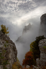 Fototapeta na wymiar Autumn fog in the Ai-Petri mountains in Crimea