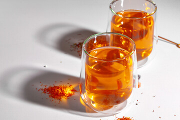 Two cups of tea on white table