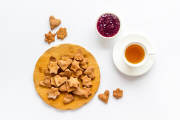 Breakfast with cookies berry jam and tea