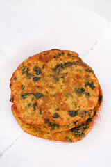 Delicious Indian Masala Puri or Methi Puri. Indian Bread Made of fenugreek leaves.