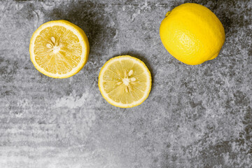 Obraz na płótnie Canvas Yellow Lemons on gray concrete table.