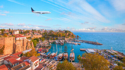 Naklejka premium White an air plane fly over the Old Town Kaleici - Antalya, Turkey