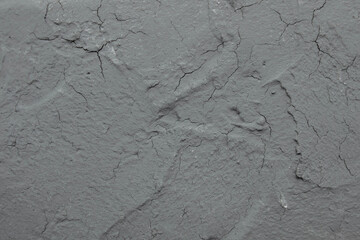 Abstract texture of gray old putty and cement with cracks wall close-up, copy space, vintage...