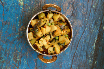 Indian recipe, mixed veg containing potato, Pea, CAULIFLOWER and Eggplant.