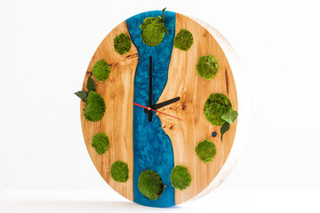 painting of the artist. Icelandic sterilized moss for decoration. Wooden large clock with epoxy resin and elements of moss